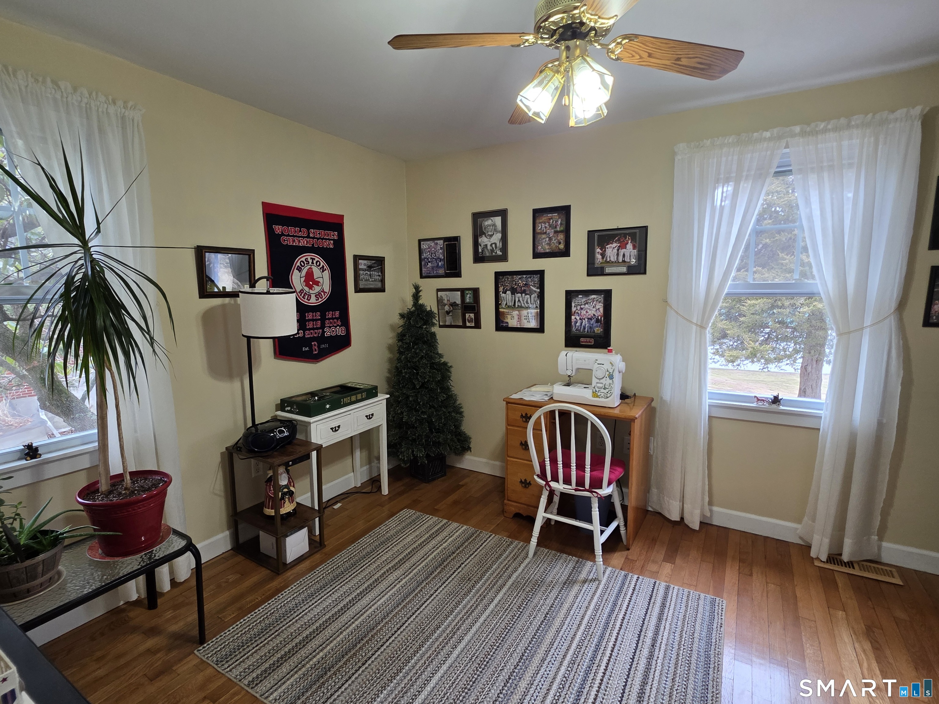 22 Pond Road Franklin, CT 06254 - Photo 16 of 34 a living room with furniture and a wooden floor