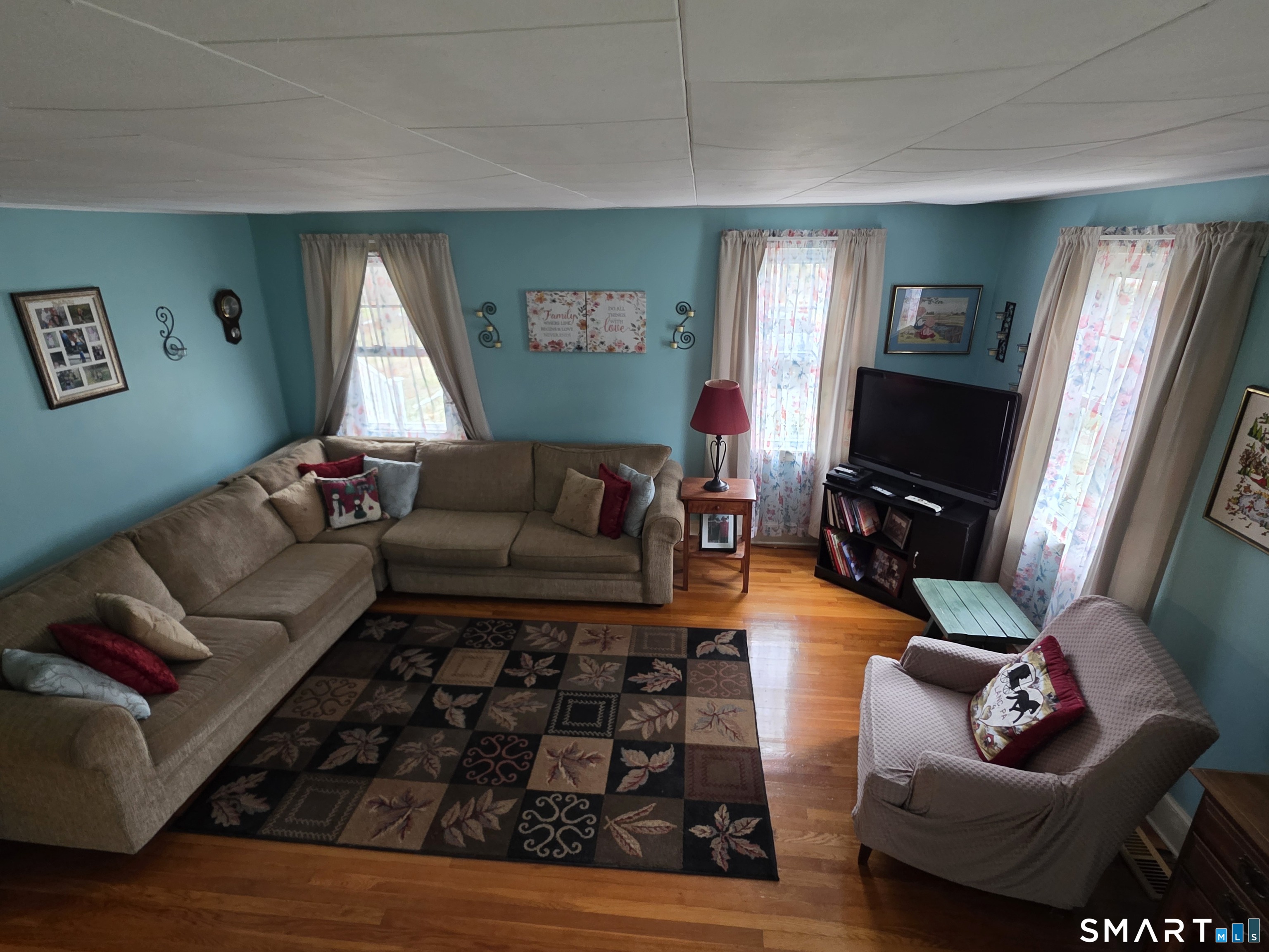 22 Pond Road Franklin, CT 06254 - Photo 20 of 34 a living room with furniture and a flat screen tv