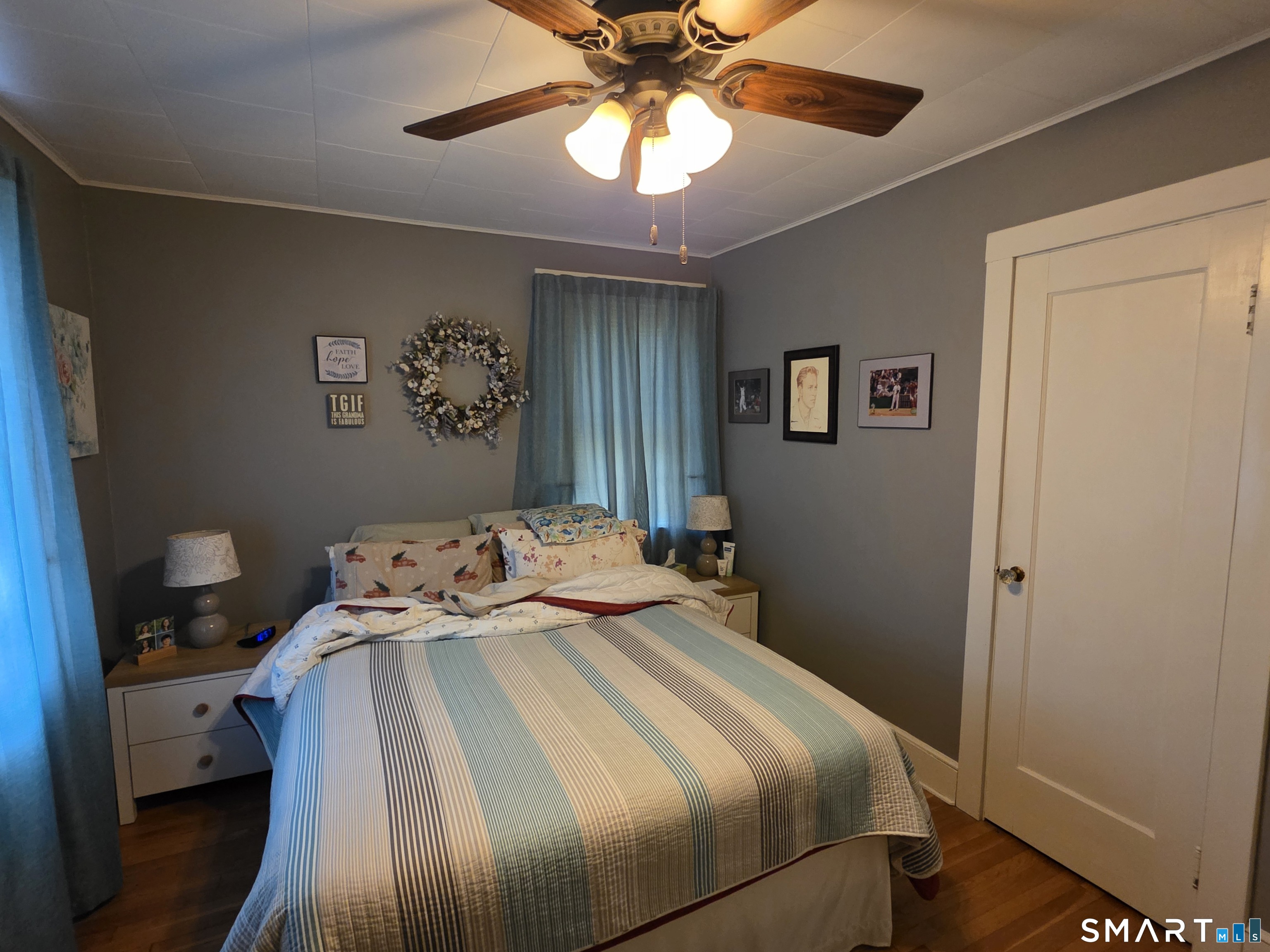 22 Pond Road Franklin, CT 06254 - Photo 21 of 34 a bedroom with a bed and a chandelier