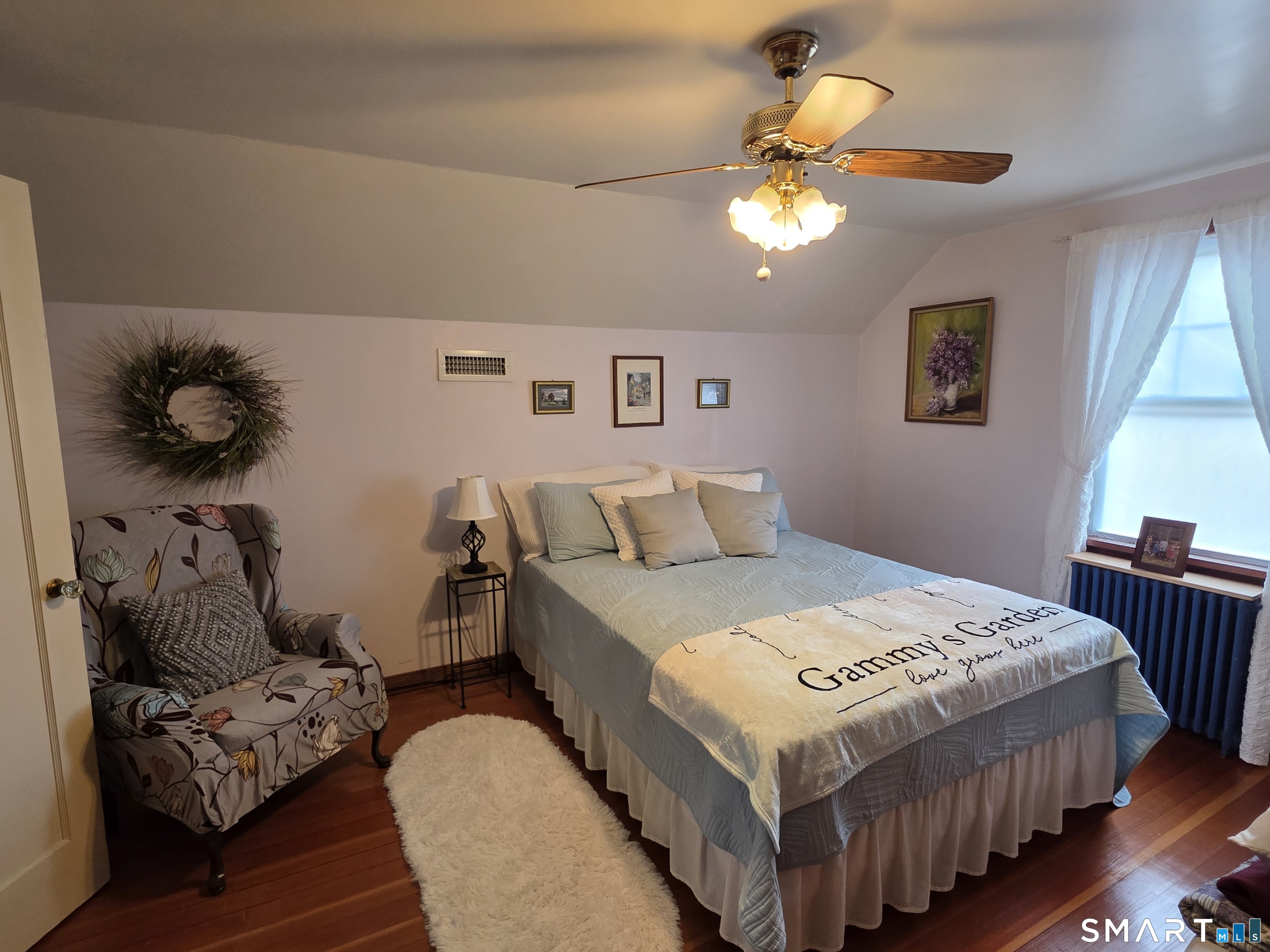 22 Pond Road Franklin, CT 06254 - Photo 23 of 34 a bedroom with a bed and a chandelier