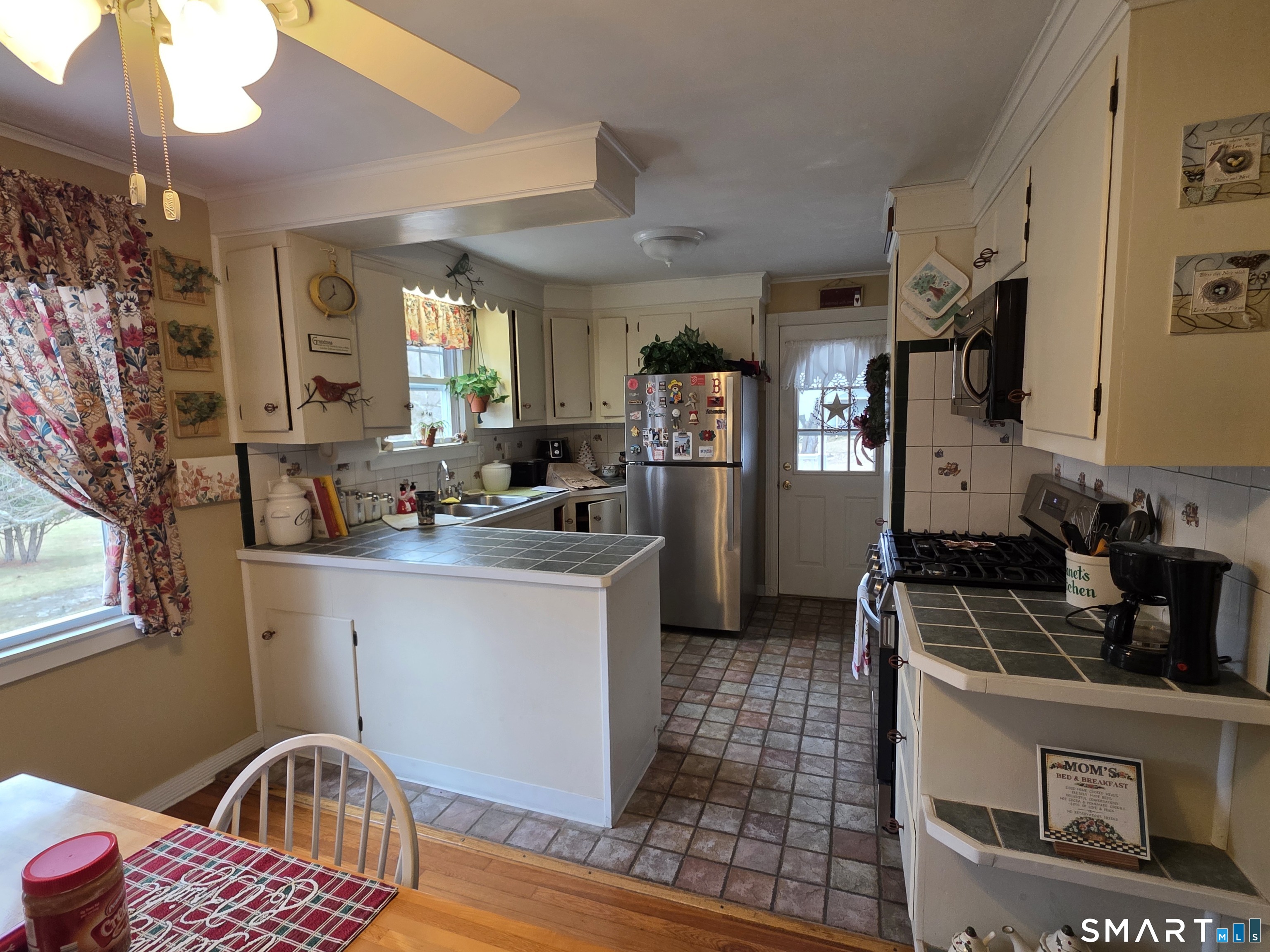 22 Pond Road Franklin, CT 06254 - Photo 4 of 34 a kitchen that has a sink cabinets counter space and a window