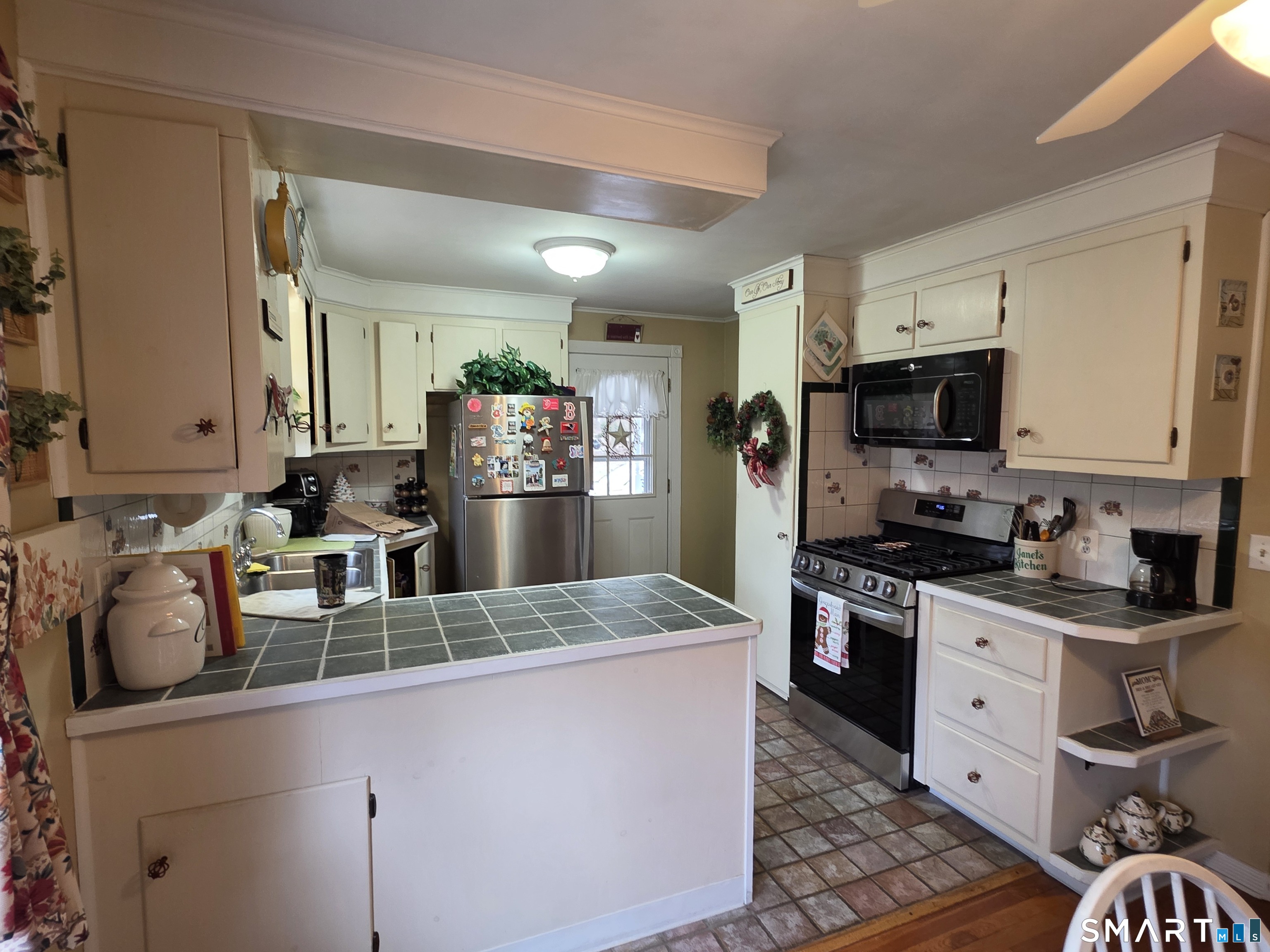 22 Pond Road Franklin, CT 06254 - Photo 10 of 34 a kitchen with stainless steel appliances granite countertop a sink stove and refrigerator