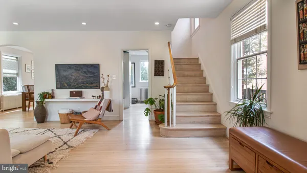 a living room with furniture or couch and a bookshelf