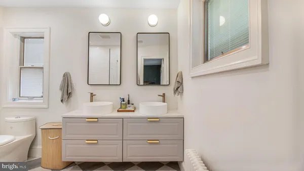 a bathroom with a toilet sink and shower