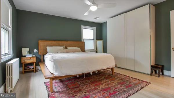 a bedroom with a bed and window