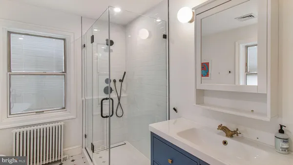 a bathroom with a sink a toilet and a bathtub