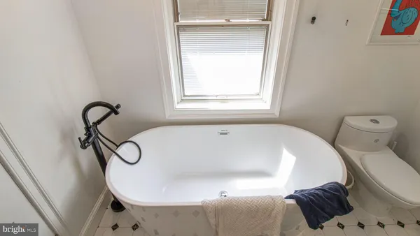 a bathroom with a shower sink and mirror