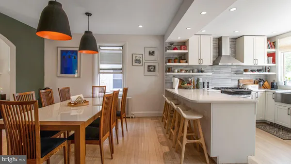 a kitchen with a sink a stove a refrigerator and cabinets