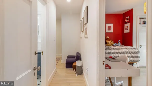 a bedroom with a bed and a table in it