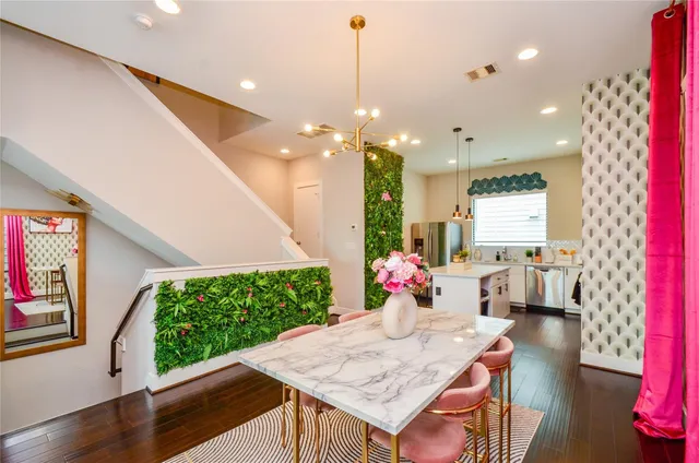 a view of a dining room with furniture window and wooden floor