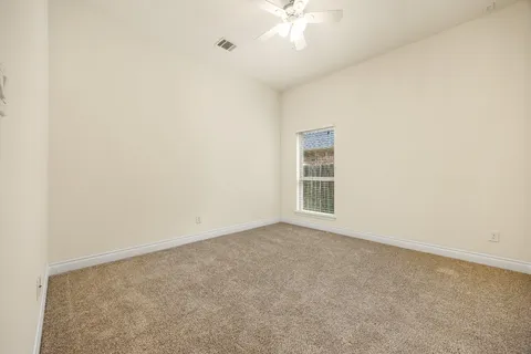 an empty room with a empty space and a window