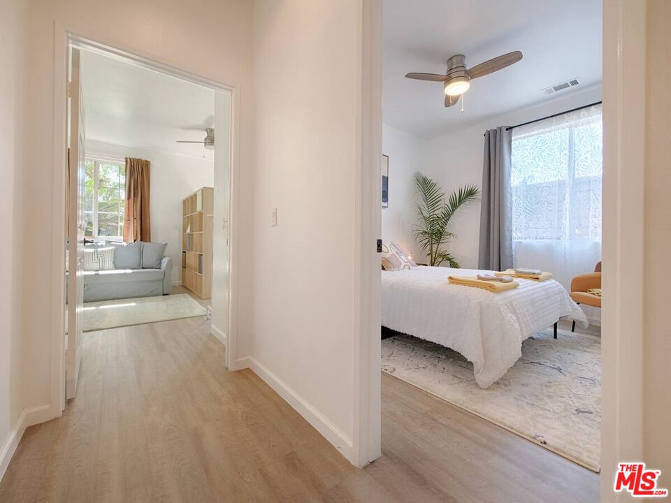 80718 Mountain Mesa Drive Indio, CA 92201 - Photo 15 of 43 a spacious bedroom with a bed and a mirror