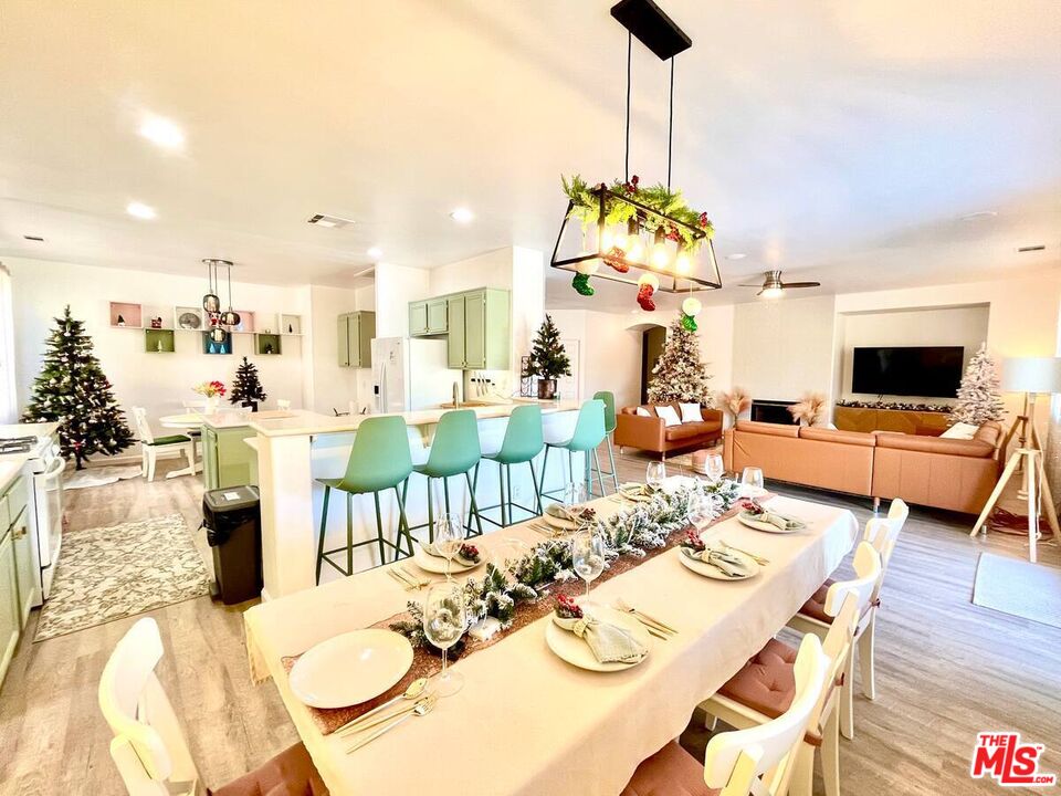 80718 Mountain Mesa Drive Indio, CA 92201 - Photo 22 of 43 a living room with fireplace furniture and a wooden floor