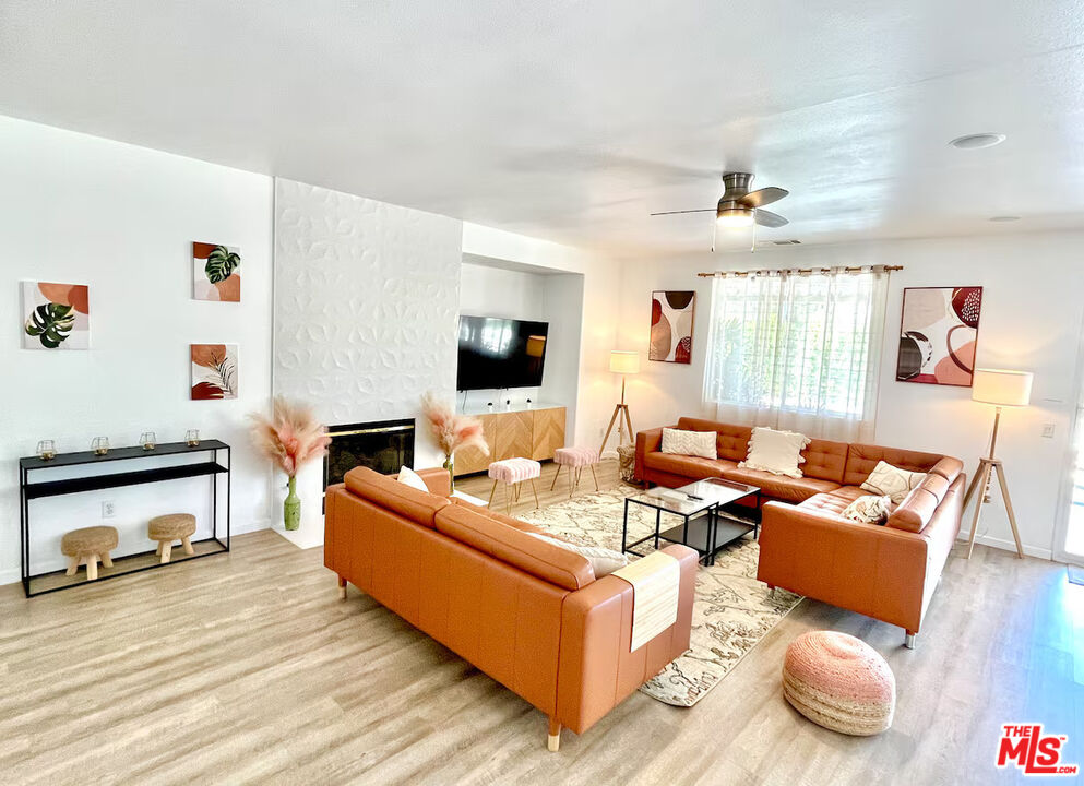 80718 Mountain Mesa Drive Indio, CA 92201 - Photo 26 of 43 a living room with furniture and a flat screen tv