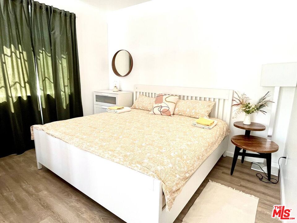 80718 Mountain Mesa Drive Indio, CA 92201 - Photo 30 of 43 a bed sitting in a bedroom next to a window with outer view