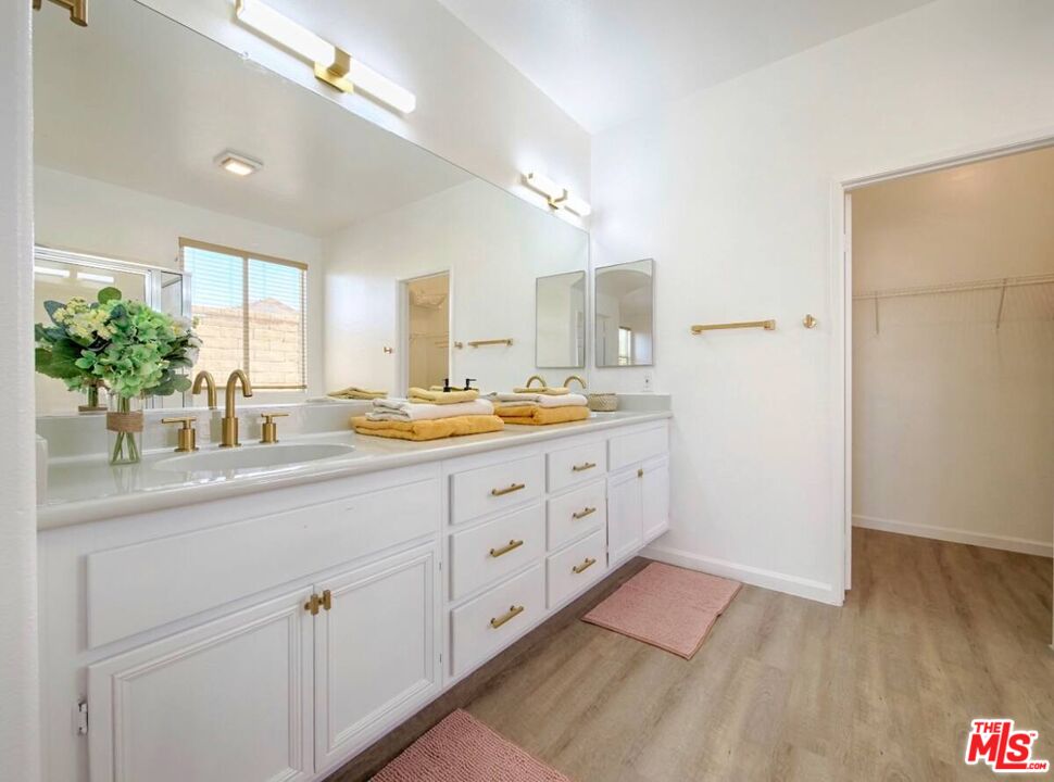 80718 Mountain Mesa Drive Indio, CA 92201 - Photo 32 of 43 a bathroom with a sink and a mirror