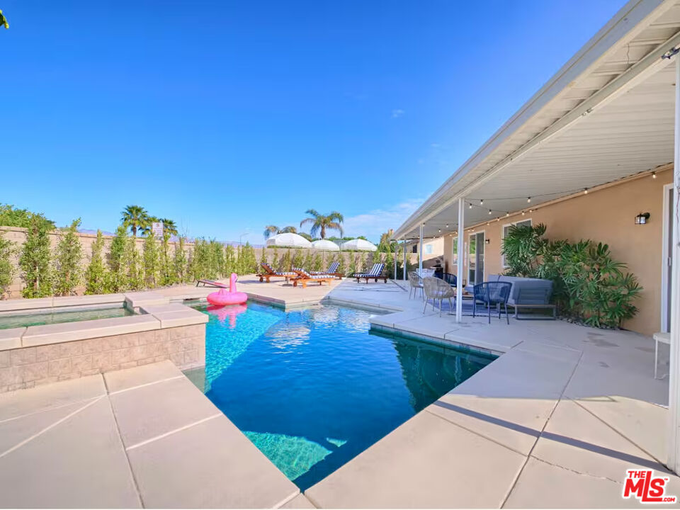 80718 Mountain Mesa Drive Indio, CA 92201 - Photo 36 of 43 a view of a patio with swimming pool