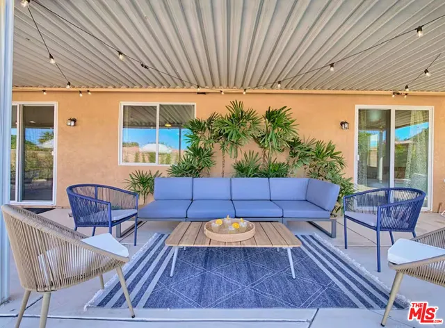 a outdoor space with patio lots of furniture and wooden floor