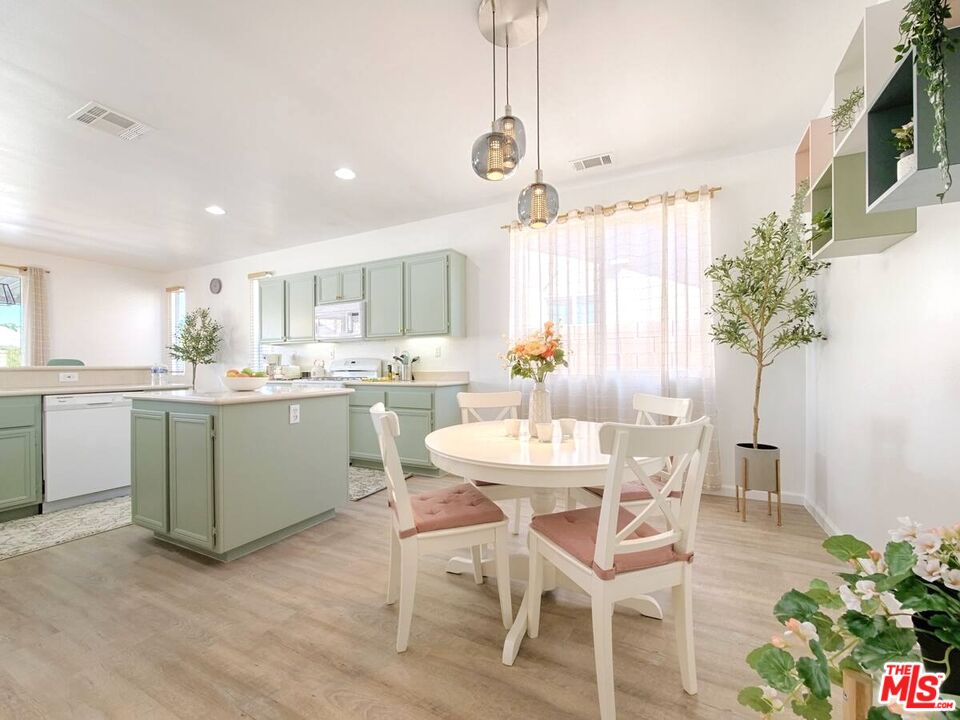 80718 Mountain Mesa Drive Indio, CA 92201 - Photo 7 of 43 a kitchen with a table and chairs in it