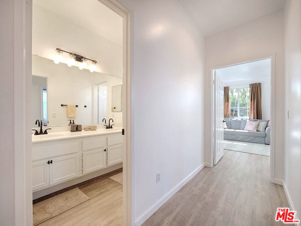 80718 Mountain Mesa Drive Indio, CA 92201 - Photo 10 of 43 a en suite bathroom with a granite countertop sink and a mirror