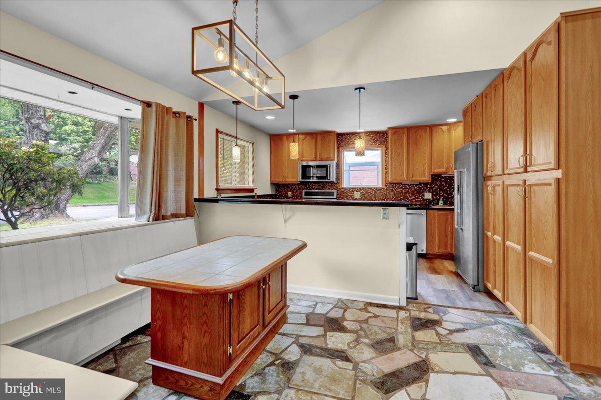 2304 Alsace Road Reading, PA 19604 - Photo 15 of 38 a kitchen with stainless steel appliances granite countertop a refrigerator a sink and a stove