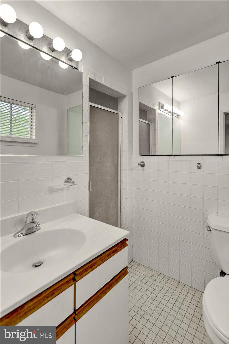2304 Alsace Road Reading, PA 19604 - Photo 22 of 38 a bathroom with a sink and a mirror