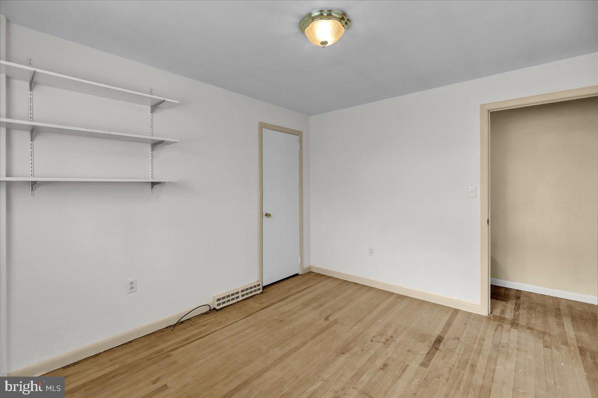 2304 Alsace Road Reading, PA 19604 - Photo 23 of 38 an empty room with wooden floor and windows