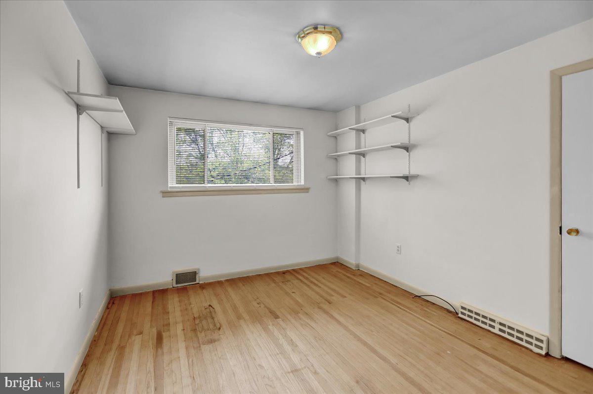 2304 Alsace Road Reading, PA 19604 - Photo 24 of 38 wooden floor in an empty room with a window