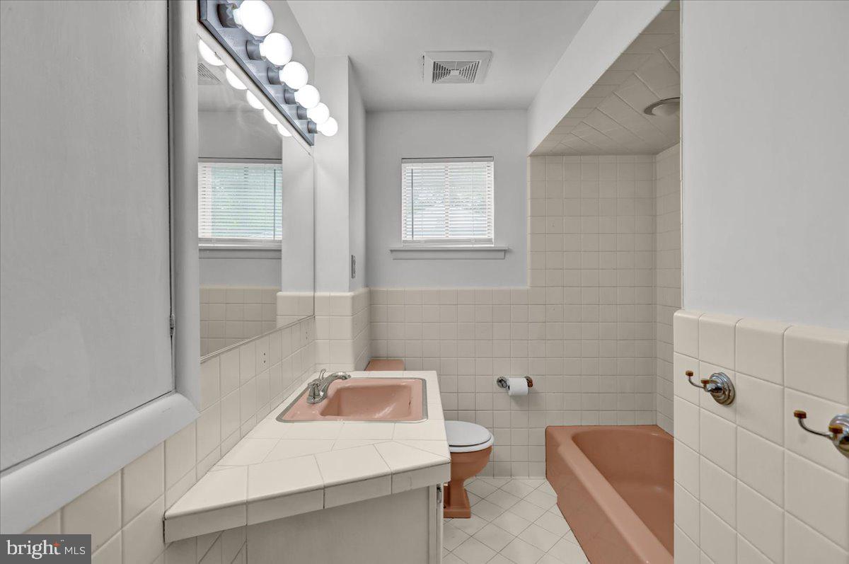 2304 Alsace Road Reading, PA 19604 - Photo 27 of 38 a bathroom with a sink a toilet and shower