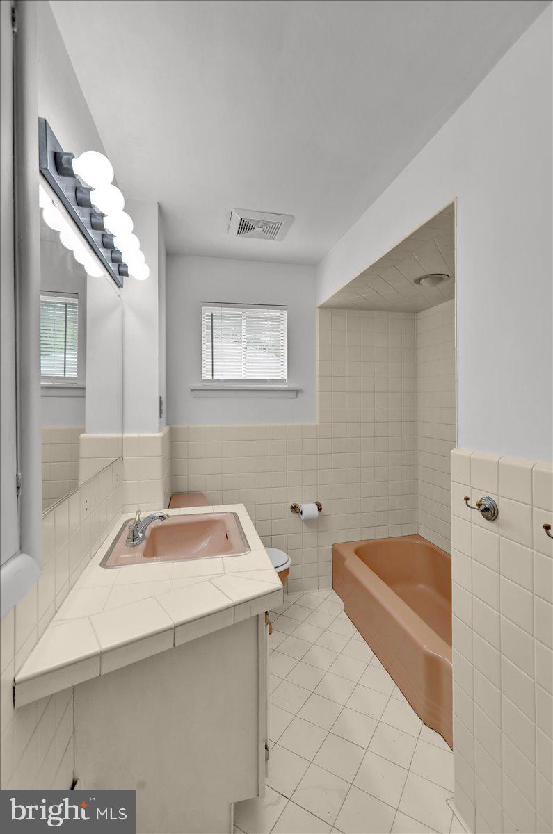 2304 Alsace Road Reading, PA 19604 - Photo 28 of 38 a bathroom with a sink a toilet and shower