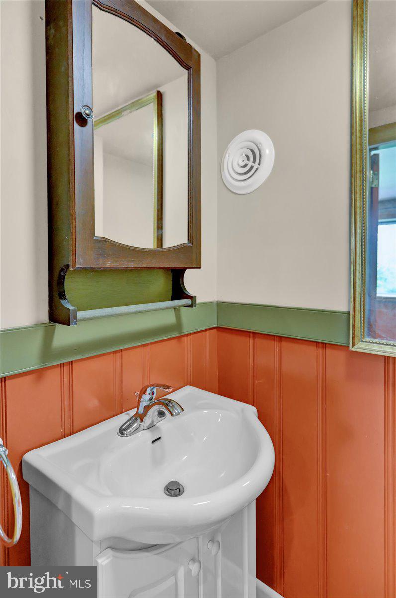 2304 Alsace Road Reading, PA 19604 - Photo 32 of 38 a bathroom with a sink and a mirror