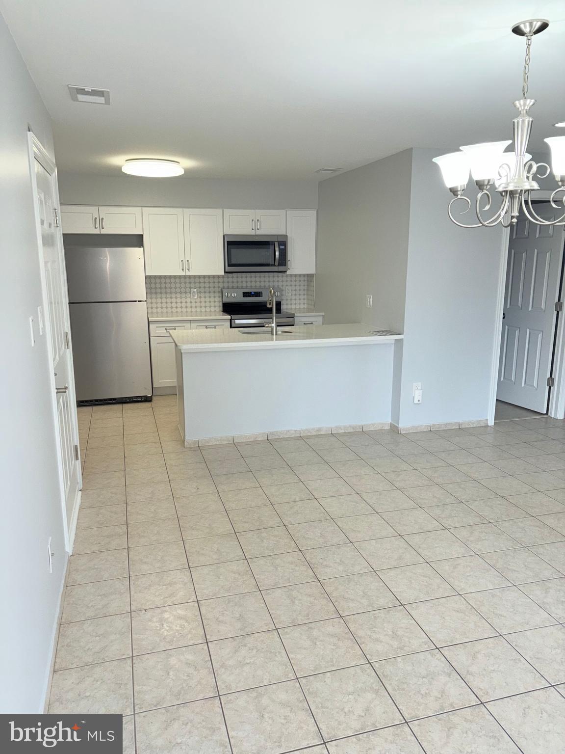 265 Barclay Court West Deptford, NJ 08051 - Photo 2 of 16 a kitchen with stainless steel appliances a refrigerator sink and microwave