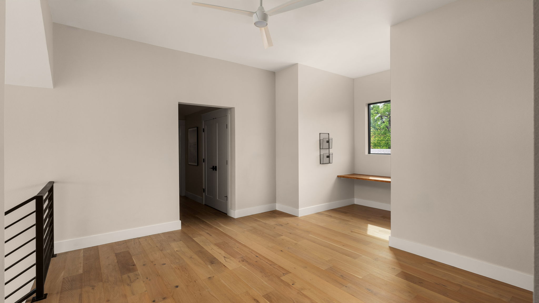 1909 West 40th Street Austin, TX 78731 - Photo 27 of 40 a view of an empty room with wooden floor and a window