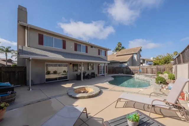 a front view of house with yard outdoor seating and barbeque oven
