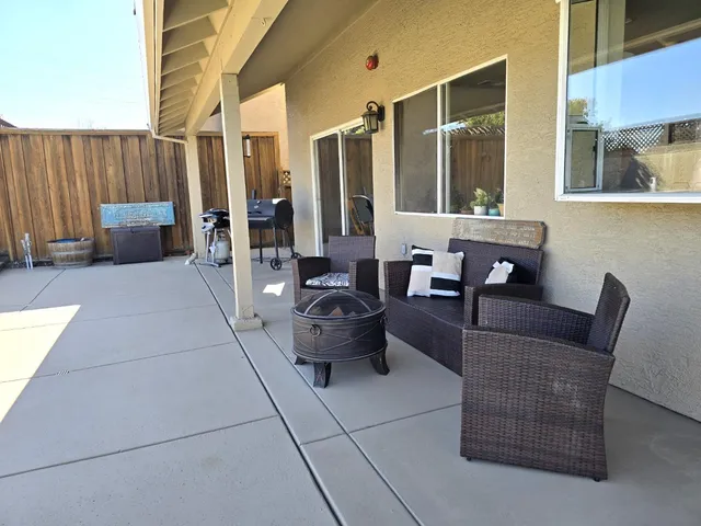 a living room with furniture and a window