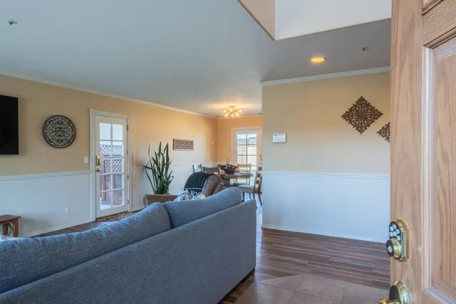 a living room with furniture and a table