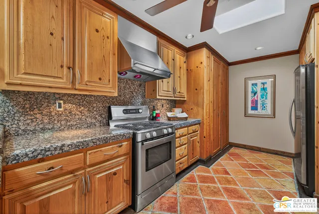 a dining room with furniture and a floor to ceiling window