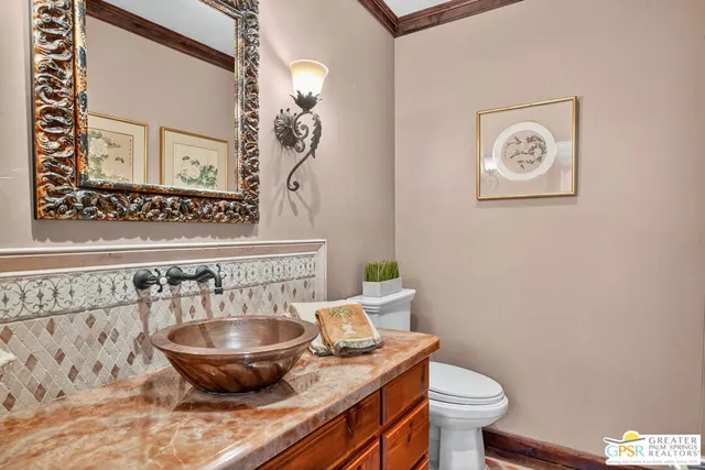 a living room with fireplace furniture and a large window