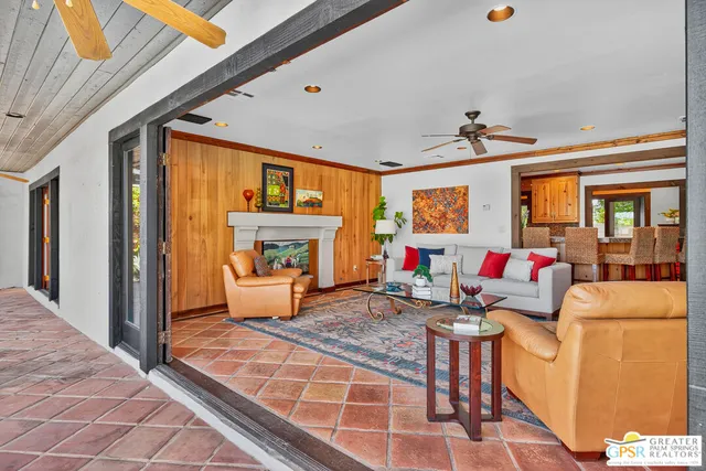 a view of a dining room with furniture and window