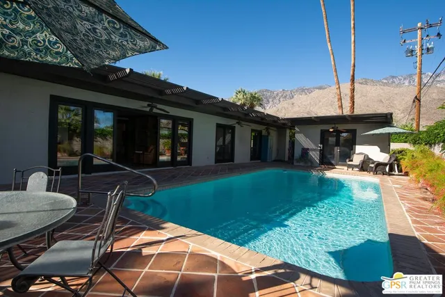 a bedroom with a bed and a fireplace