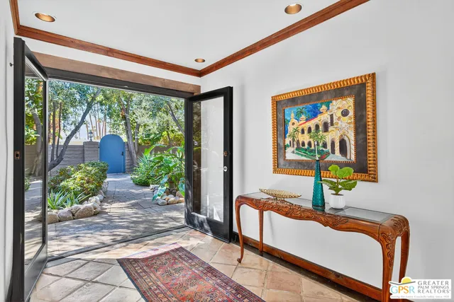 a living room with lots of furniture and a rug