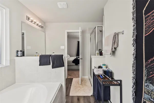 a bathroom with a shower and mirror