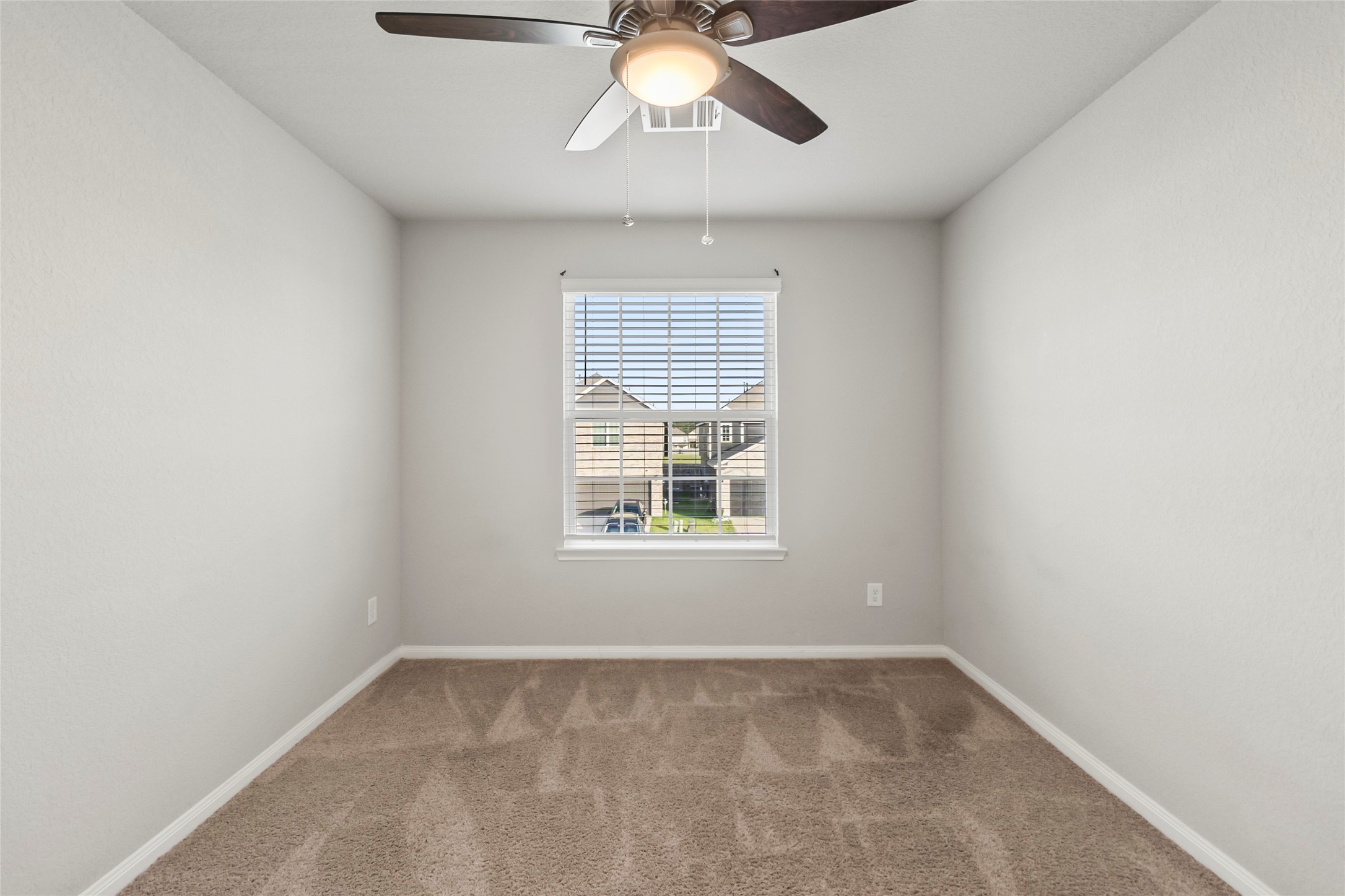 4831 Blue Jacaranda Way Spring, TX 77373 - Photo 17 of 24 a view of an empty room with a window