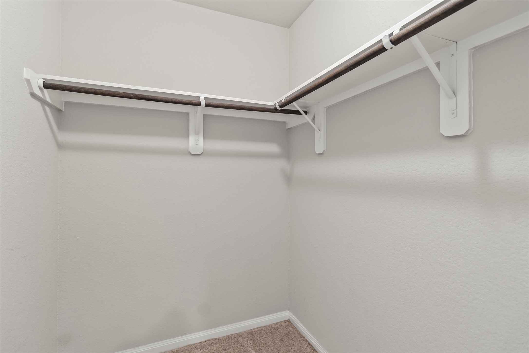 4831 Blue Jacaranda Way Spring, TX 77373 - Photo 18 of 24 a view of a room with racks on the wall