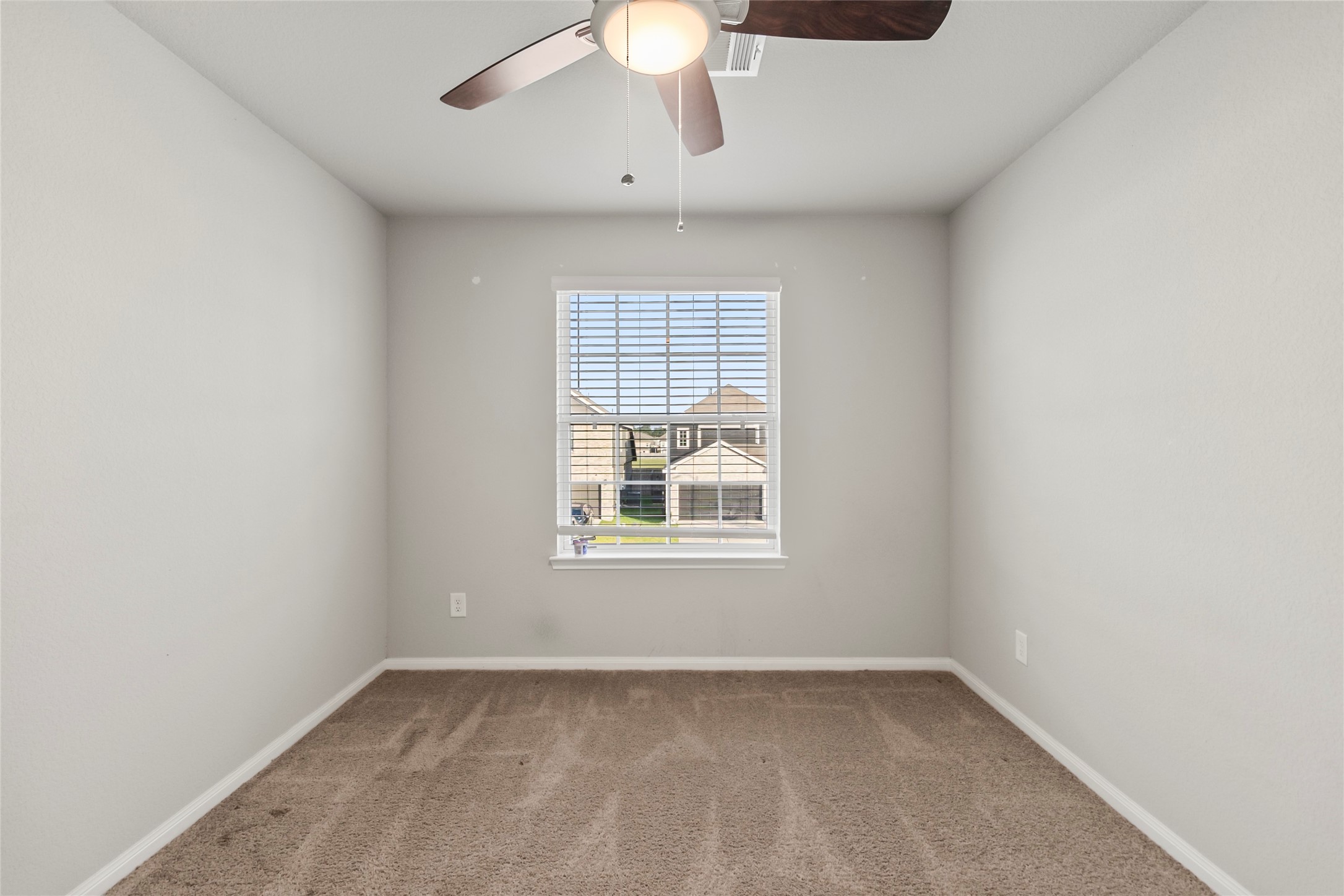 4831 Blue Jacaranda Way Spring, TX 77373 - Photo 19 of 24 an empty room with a window