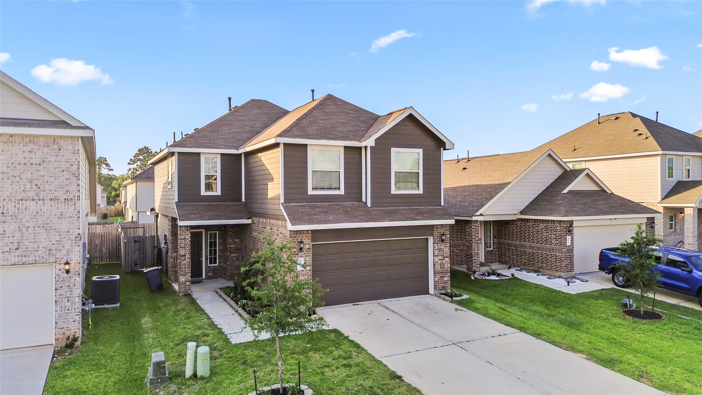 4831 Blue Jacaranda Way Spring, TX 77373 - Photo 2 of 24 a front view of a house with garden