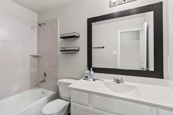 a view of a house with patio and a yard