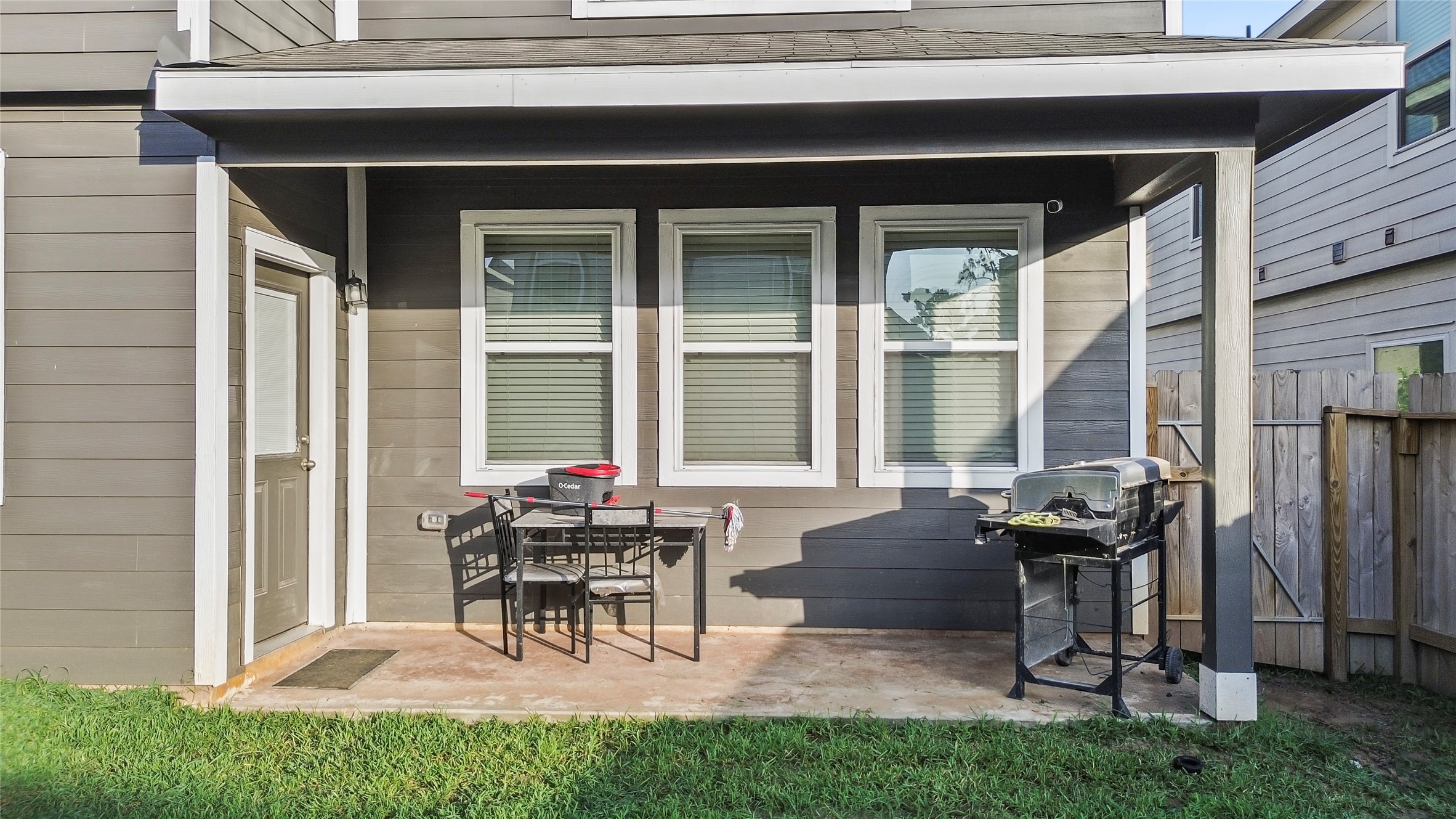 4831 Blue Jacaranda Way Spring, TX 77373 - Photo 22 of 24 a view of a house with patio and a yard
