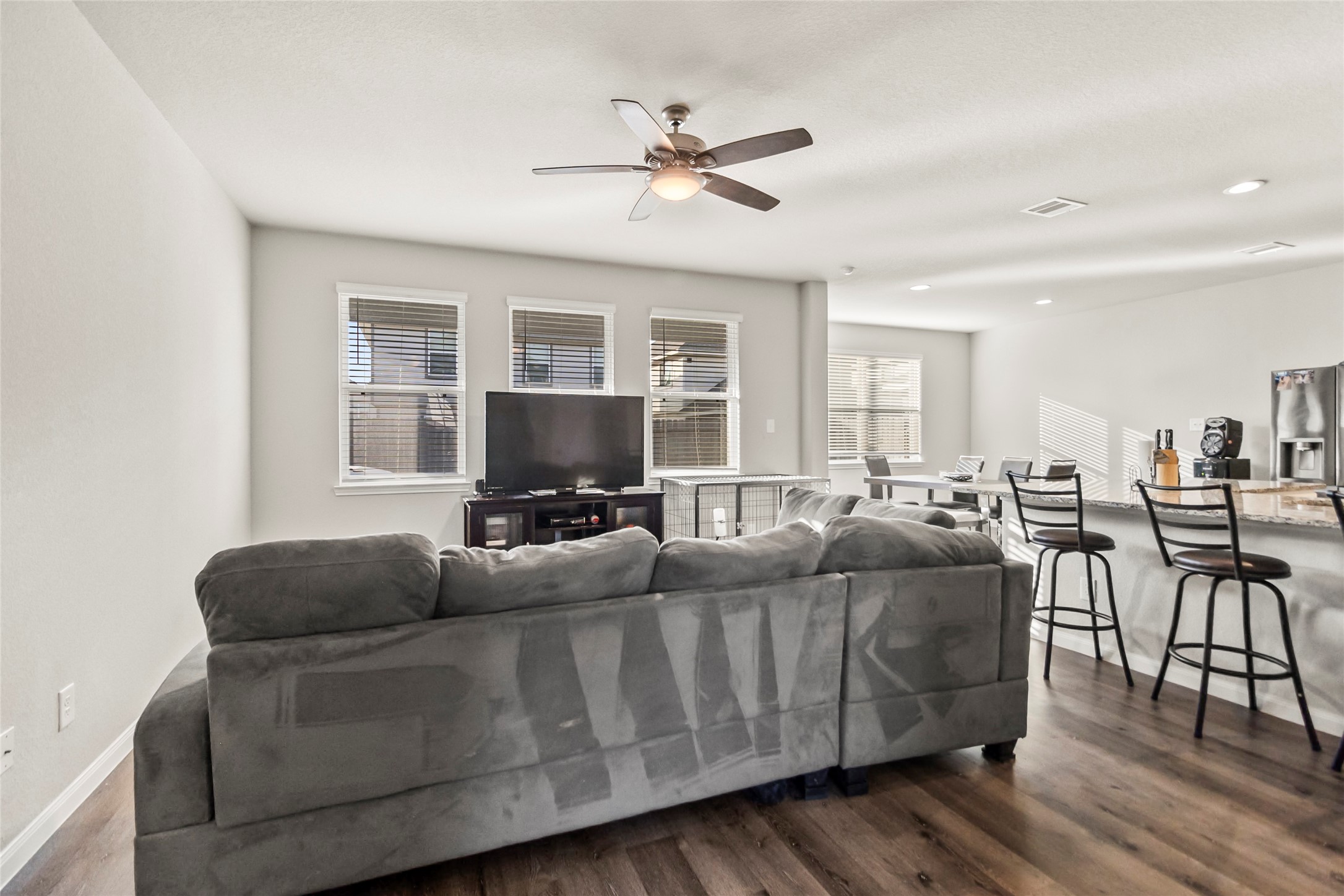4831 Blue Jacaranda Way Spring, TX 77373 - Photo 3 of 24 a living room with furniture and a flat screen tv