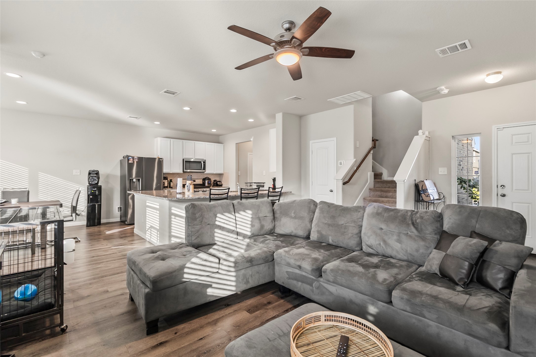 4831 Blue Jacaranda Way Spring, TX 77373 - Photo 5 of 24 a living room with furniture kitchen view and a chandelier